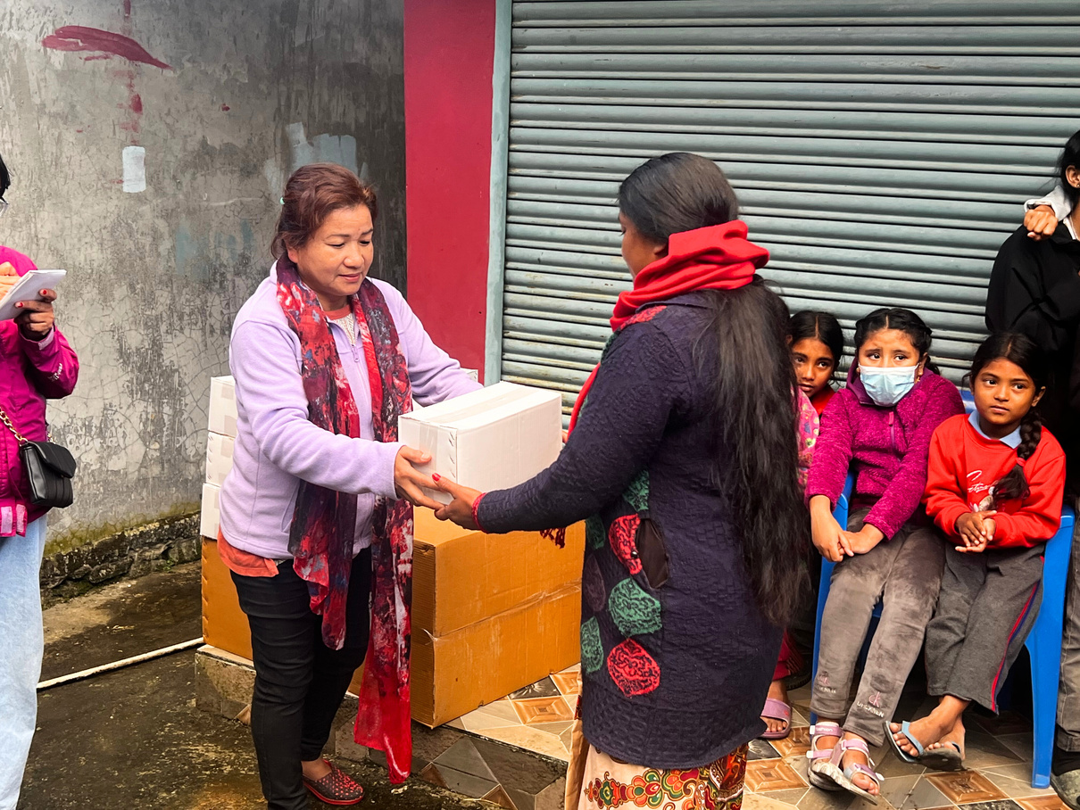 Community delivery of donated supplies in Pokhara